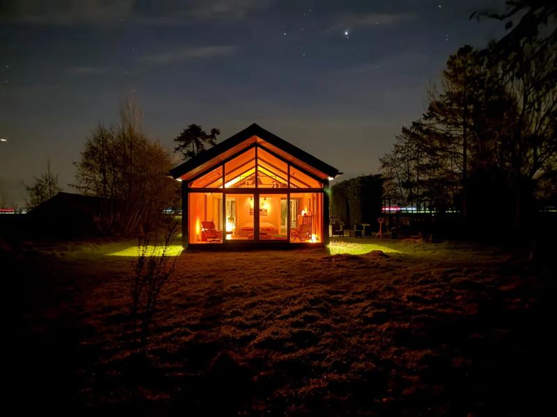 Wooden cabin entrance with bench